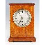 An early 20th century mahogany mantel timepiece with eight day fusee movement, the silvered circular