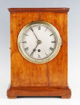 An early 20th century mahogany mantel timepiece with eight day fusee movement, the silvered circular