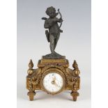 A late 19th century French gilt metal and patinated spelter mantel timepiece, the movement with