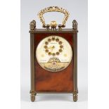 An early 20th century brass and faux tortoiseshell keyless wind diminutive carriage timepiece with