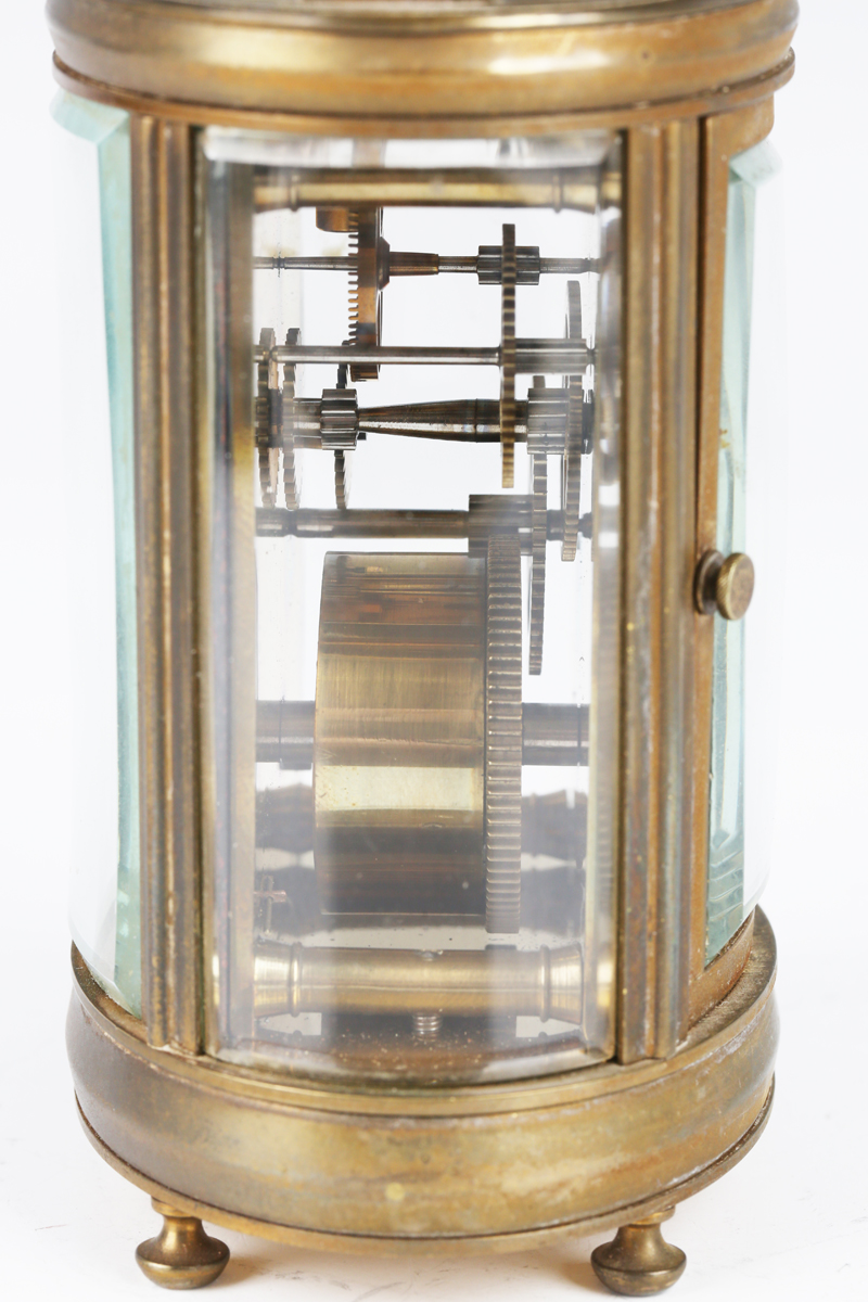A 20th century brass oval carriage timepiece with eight day movement, the enamelled dial with - Image 5 of 6