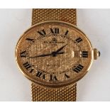 A Baume & Mercier Genève Baumatic 18ct gold oval cased gentleman's bracelet wristwatch, the signed