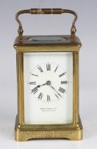 An early 20th century French lacquered brass carriage clock with eight day movement striking on a