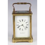 An early 20th century French lacquered brass carriage clock with eight day movement striking on a