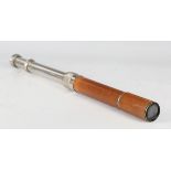 A mid-20th century Britex Spotter leather bound two-draw telescope, unextended length 29.8cm,