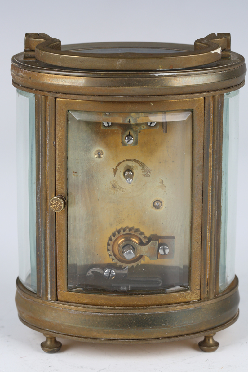 A 20th century brass oval carriage timepiece with eight day movement, the enamelled dial with - Image 4 of 6