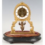 A late 19th century French brass mantel timepiece with eight day movement, the white enamelled