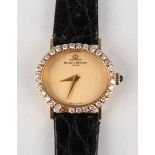A Baume & Mercier 18ct gold and diamond set oval cased lady's wristwatch, the signed brushed gilt