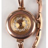 A Rolex 9ct gold circular cased lady's wristwatch with signed jewelled movement, the unsigned gilt
