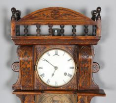 A Victorian Aesthetic oak cased Admiral Fitzroy clock barometer, the white circular dial with