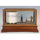 An early 20th century mahogany barograph with gilt brass mechanism and clockwork recording drum, the