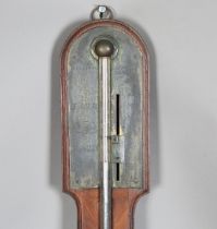 An early 19th century figured mahogany stick barometer, the brass dial with Vernier scale, signed '