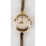 A Tudor 18ct gold cased lady's wristwatch, the signed circular dial with dot and baton hour