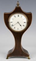 An Edwardian mahogany balloon shaped mantel timepiece, the eight day movement with platform