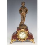 An early 20th century marble, brown patinated and gilt spelter mantel clock with eight day