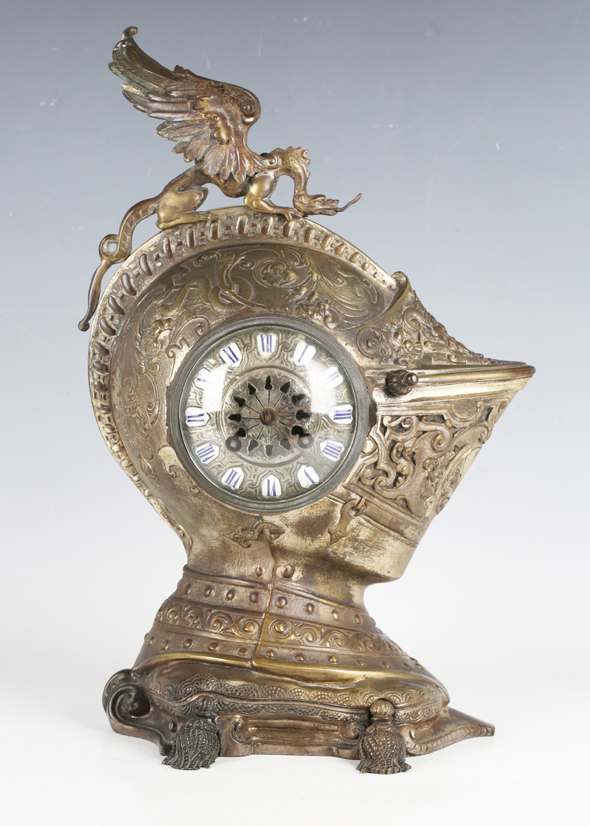 A late 19th century French silvered and brown patinated bronze mantel clock in the form of a
