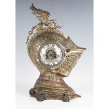 A late 19th century French silvered and brown patinated bronze mantel clock in the form of a
