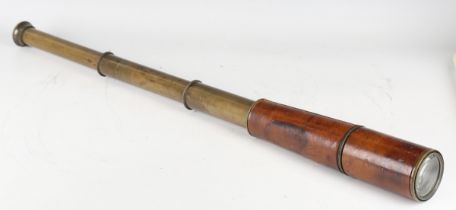 An early 20th century First World War period leather mounted brass three-draw telescope, detailed '