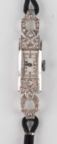 A diamond set lady's dress wristwatch, the jewelled movement detailed 'Swiss Made', the silvered