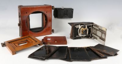 A late 19th century mahogany and gilt brass plate camera (faults), with various accessories.Buyer’