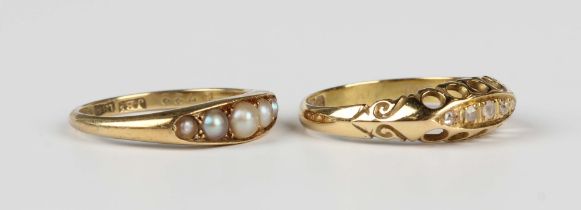 An 18ct gold and diamond five stone ring in a boat shaped design, Birmingham 1910, ring size