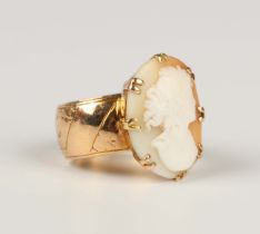 A 9ct gold ring with engraved decoration, later applied with a shell cameo, carved as a portrait