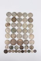 A collection of USA silver coinage, including two one dollars, 1922 and 1924, three half-dollars,