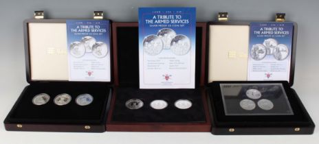 A group of three Elizabeth II Westminster Mint Tribute to the Armed Services silver three-coin