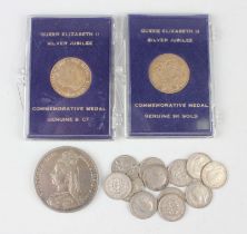 Two Elizabeth II gold medals commemorating the Silver Jubilee, each cased, together with a