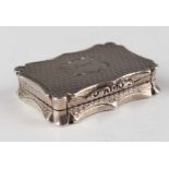 An early Victorian silver vinaigrette of shaped rectangular form with engine turned decoration,