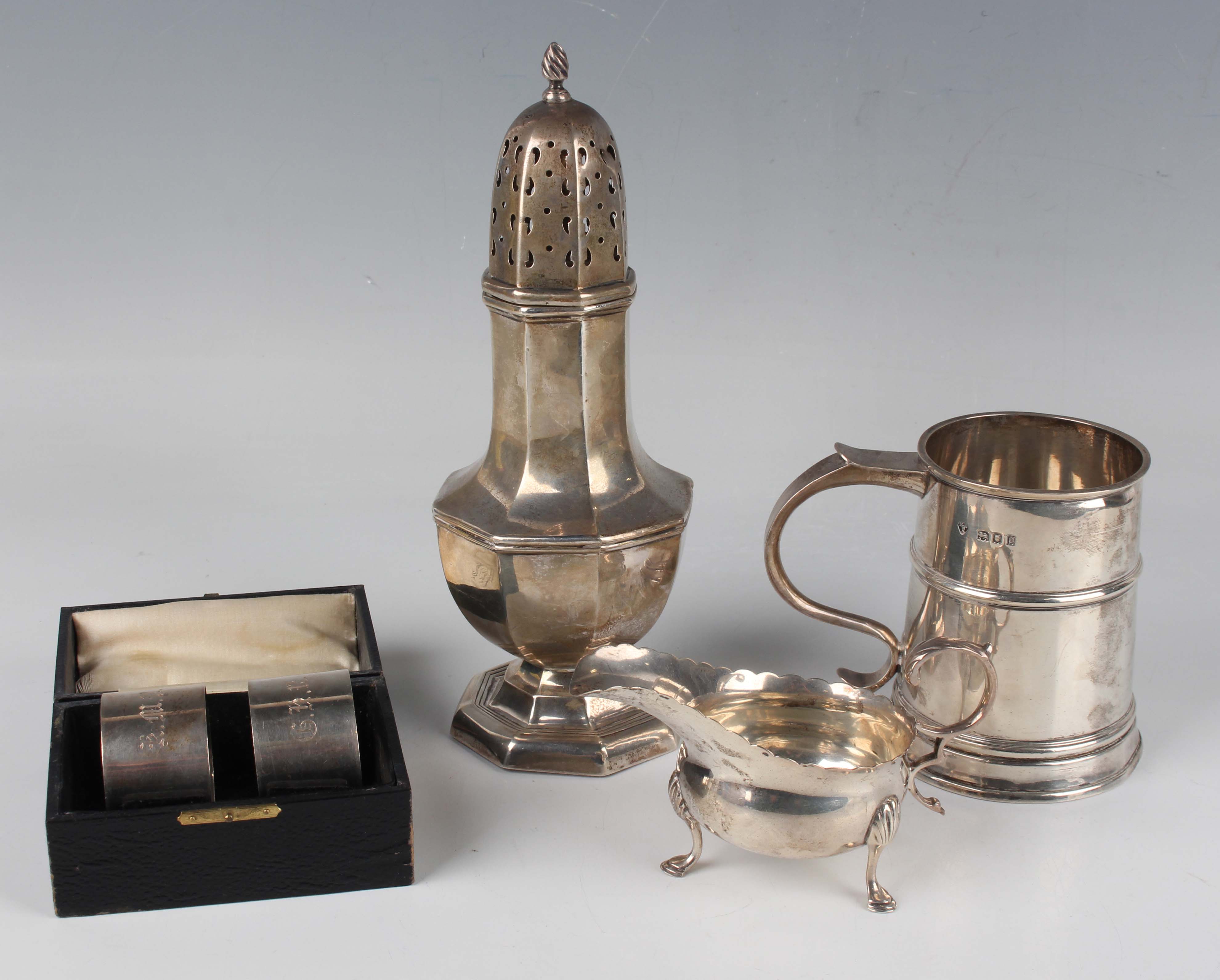 A George V silver tankard of girdled tapering cylindrical form with scroll handle, London 1919 by