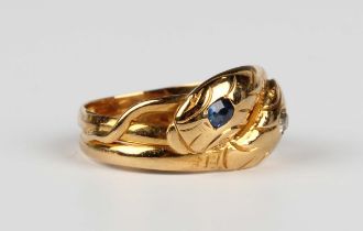 An 18ct gold, diamond and sapphire ring, designed as two entwined snakes, mounted with a cushion cut