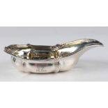 A George IV silver pap boat with reeded scroll and leaf border, London 1828 (maker's mark rubbed),