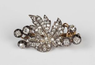 A gold backed, silver set and diamond brooch, 19th century, designed as a vine leaf and grapes,
