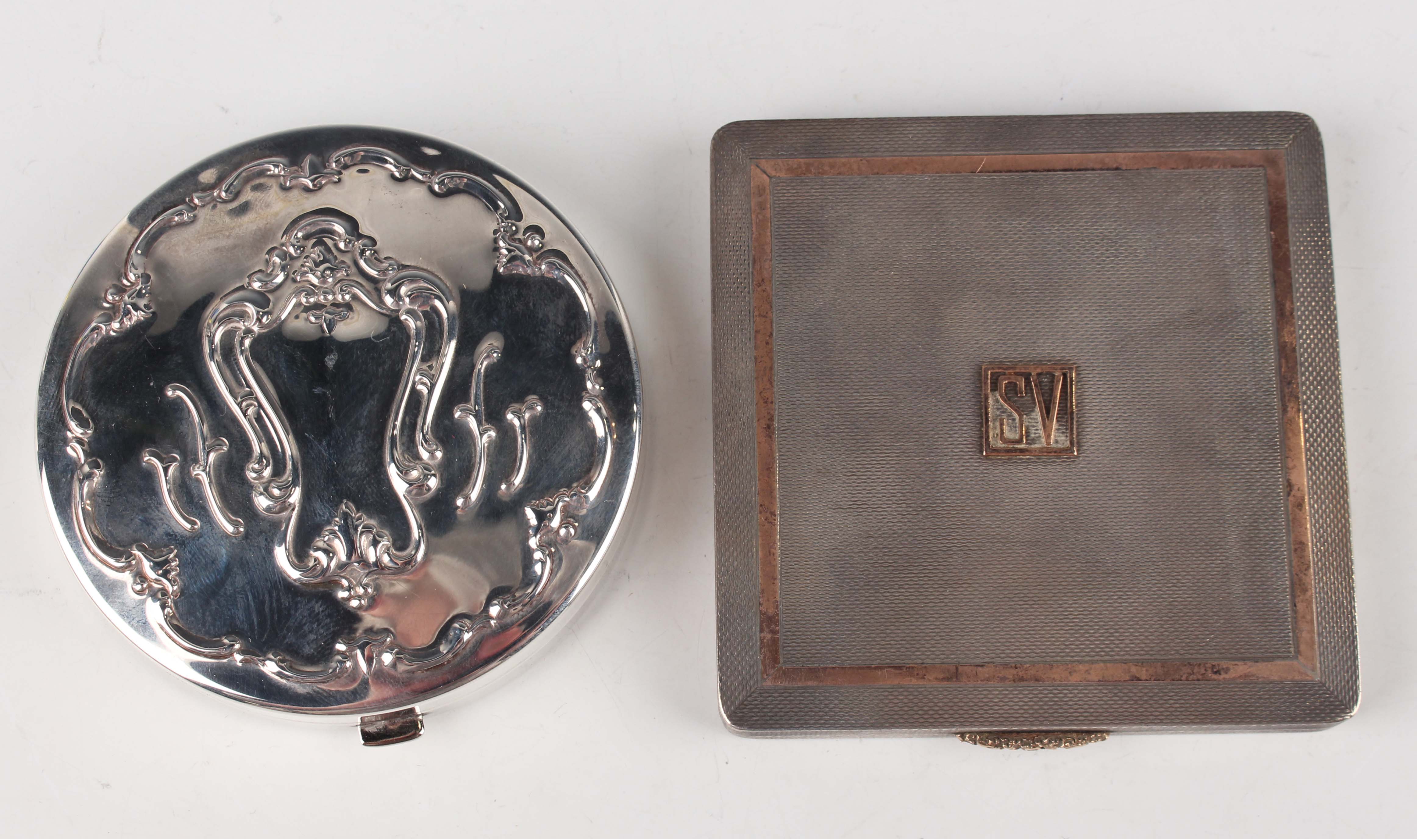 An Elizabeth II silver and parcel gilt square powder compact, the front applied with initials '