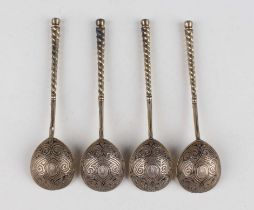 A set of four Russian silver gilt and niello spoons, 84 zolotnik, each fig shaped bowl back monogram