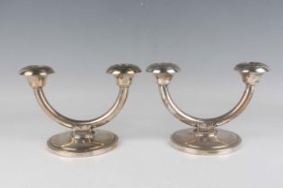 A pair of Norwgian .830 silver twin branch candelabra, each semicircular branch with circular