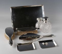 An Edwardian silver seven-piece dressing table set, monogram engraved, comprising a rectangular