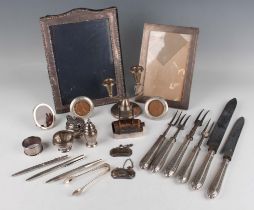 A group of silver, including a George V rectangular photograph frame, London 1912 by Mappin &
