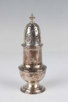 A George II silver baluster pepper caster with pierced domed cover and knop finial, on a circular