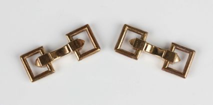A pair of Cartier gold cufflinks with sprung openwork rectangular backs and fronts, detailed '