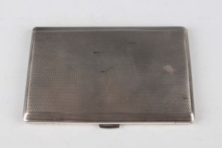 An Elizabeth II silver rectangular engine turned cigarette case, the interior presentation