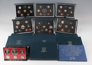 A collection of Royal Mint year-type coin sets, including a United States six-coin proof set 1979.