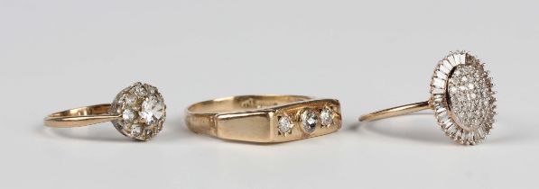 A 9ct gold and diamond oval cluster ring, mounted with circular cut diamonds within a surround of