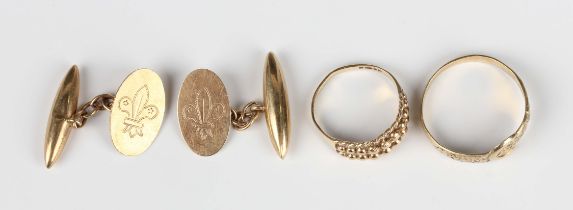 A pair of 9ct gold cufflinks, each oval front with a fleur-di-lis motif, Birmingham 1934, dimensions