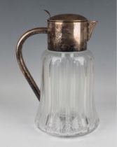An early 20th century plated and cut glass lemonade jug, the tapering cylindrical body mounted