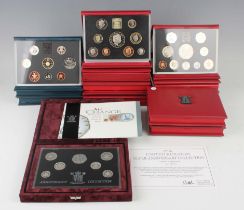 A large collection of Royal Mint year-type specimen coin sets and other commemorative coins.Buyer’