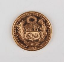 A Peru gold fifty soles 1965, together with a gold mount, unmarked, weight of mount 2.6g.