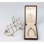 A pair of Edwardian silver wishbone sugar nips, London 1902 by Charles & George Asprey, length 8.