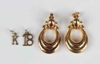 A pair of 9ct gold pendant earrings, each in a drop shaped design, with post and butterfly fittings,